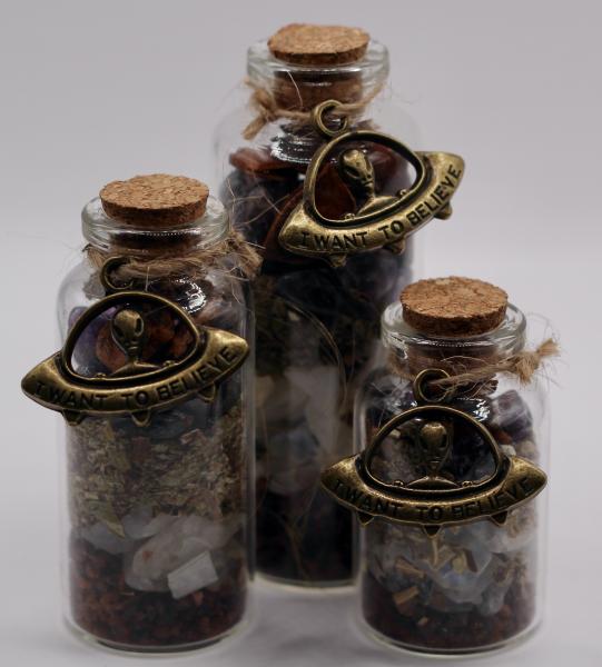 These vials contain herbs and crystals that aid in manifesting the purpose they are made for. This one in particular is made for enhancing psychic abilities.